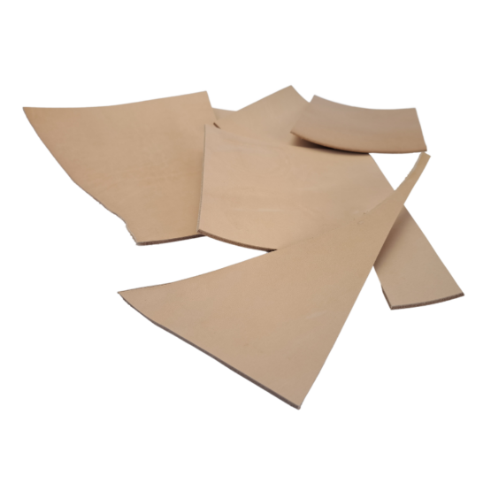 leather-offcuts-bag-500g A 500g bag containing offcuts of vegetable tan leather. The thickness of leather is approximately 2.5 to 3.5 mm.