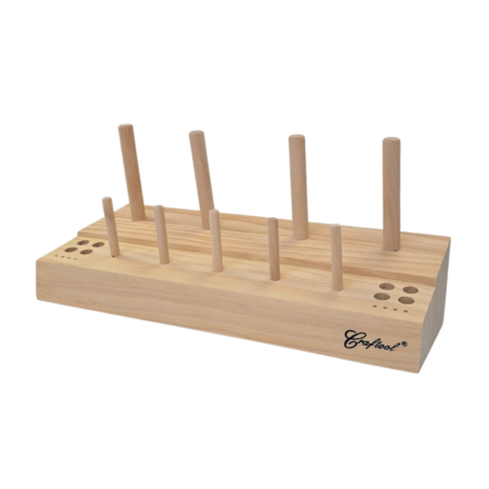 Wooden Thread Spool Rack. Holds 4 large thread spools, 5 small thread spools, and 8 needles. Also includes 4 holes for holding stitching awls and other small sewing tools.